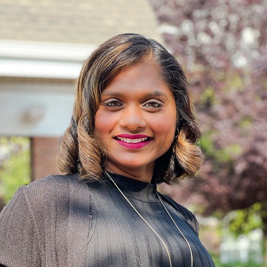 Mina Gagraj smiling outdoors.